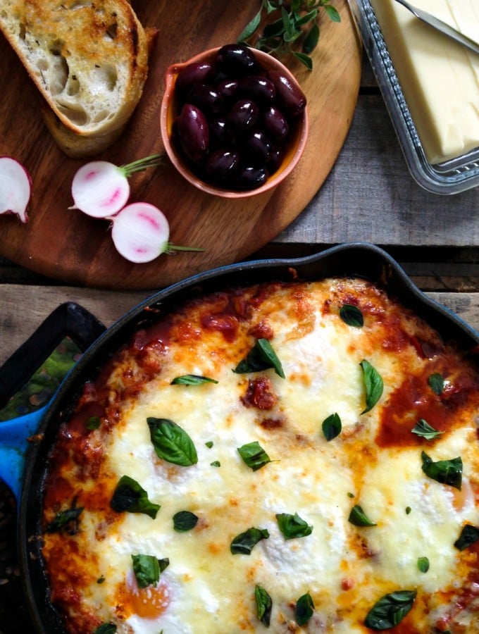 Portuguese Style Baked Eggs. Spicy tomato and red pepper sauce, three cheeses, fresh herbs from foodiewithfamily.com