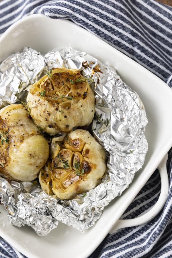 This simple “How to Roast Garlic in the Oven” will set your favourite garlic lover up for everything between a tiny and giant quantity of luscious, buttery cloves of meltingly soft garlic. Make enough to use tonight or enough to stash in the freezer for fast dinner fixes all year long!