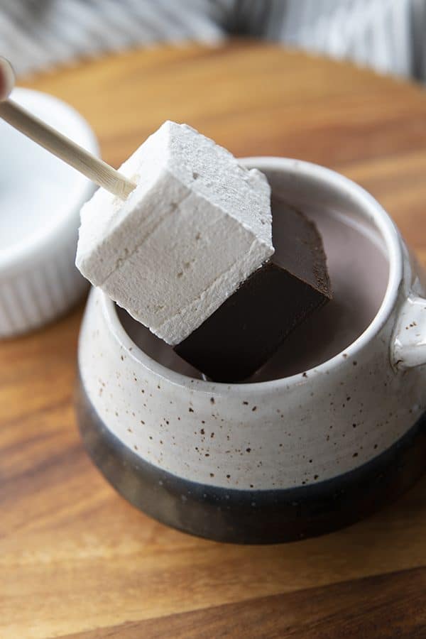 Hot Chocolate on a Stick: This creamy chocolate fudge topped with marshmallow can be left in its pure form and nibbled, or swirled through hot milk for decadent hot chocolate. 