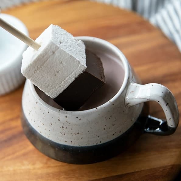 Hot Chocolate on a Stick: This creamy chocolate fudge topped with marshmallow can be left in its pure form and nibbled, or swirled through hot milk for decadent hot chocolate.