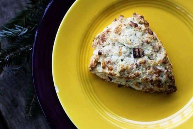 Having a bag of frozen pre-formed Bacon Cheddar Scallion Scones in the oven is your secret holiday breakfast or brunch weapon to having piping hot, tender, flaky scones studded with crispy bacon, minced scallion and tiny pockets of melted Cheddar cheese.