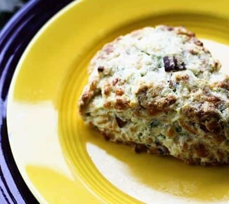 Having a bag of frozen pre-formed Bacon Cheddar Scallion Scones in the oven is your secret holiday breakfast or brunch weapon to having piping hot, tender, flaky scones studded with crispy bacon, minced scallion and tiny pockets of melted Cheddar cheese.