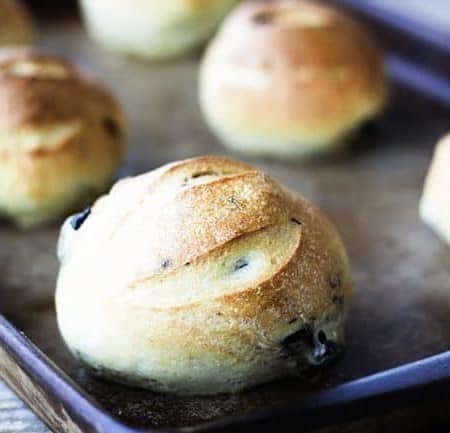 Crusty on the outside, soft on the inside, and bursting with briny oil-cured or kalamata olives, these Black Olive Sandwich Rolls are the best for sandwiches or just munching straight out of hand.