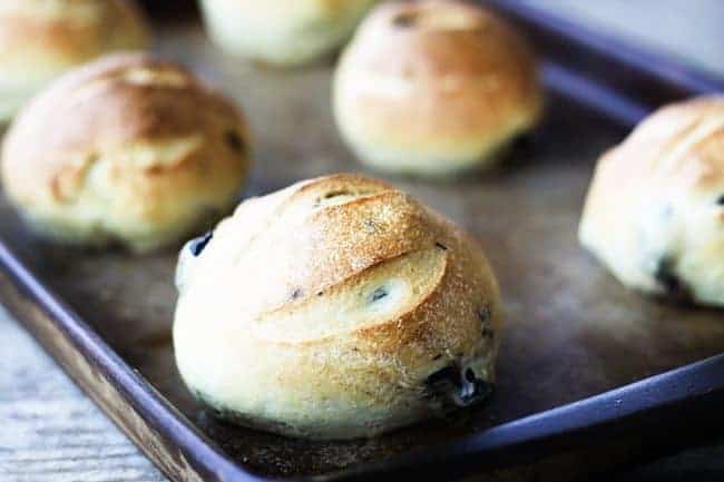 Crusty on the outside, soft on the inside, and bursting with briny oil-cured or kalamata olives, these Black Olive Sandwich Rolls are the best for sandwiches or just munching straight out of hand.