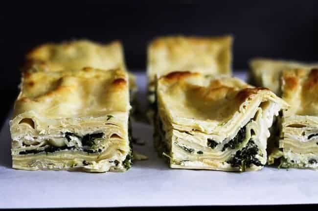 Roasted Garlic Spinach Alfredo Lasagna cut into servings to be frozen from Foodie with Family