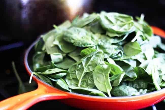 Sweating spinach for Spinach Feta Turkey Burger | www.foodiewithfamily.com