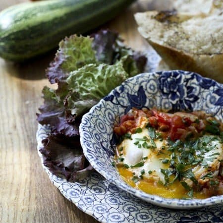 Make a fast, flavourful, garden-fresh, garlicky tomato sauce and then poach eggs directly in the sauce for a classic Shakshuka. It is traditionally served with bread for sopping up the sauce, but is equally good over cooked rice, noodles, or quinoa. The sauce can be doubled, tripled, or quadrupled and frozen in individual meal-sized portions for a taste of summer in the colder months!
