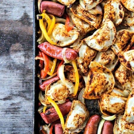 Kielbasa and Pierogies Sheet Pan Meal with juicy roasted kielbasa, crisp tender peppers and onions and puffy, potato filled pierogies.