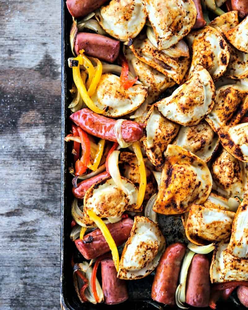 Kielbasa and Pierogies Sheet Pan Meal with juicy roasted kielbasa, crisp tender peppers and onions and puffy, potato filled pierogies.