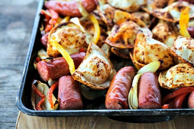 Kielbasa and Pierogies Sheet Pan Meal with juicy roasted kielbasa, crisp tender peppers and onions and puffy, potato filled pierogies.