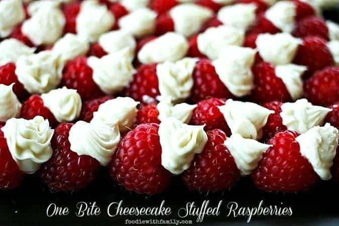 One Bite Cheesecake Stuffed Rasperries with Chambord foodiewithfamily.com #cheesecake #Dessert