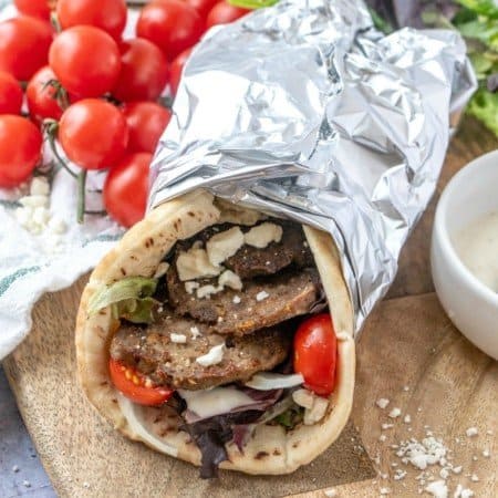 Make restaurant worthy homemade gyro meat and gyros -flat breads filled to bursting with garlicky, herbed, crisped strips of Greek/Lebanese meatloaf.