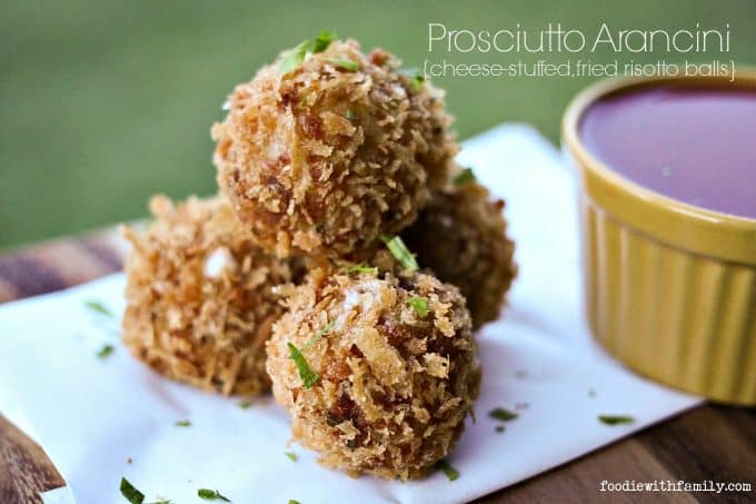Prosciutto Arancini {crispy cheese-stuffed, fried risotto balls} from foodiewithfamily.com