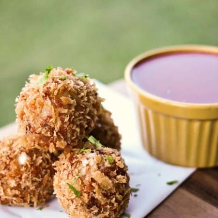 Prosciutto Arancini {crispy cheese-stuffed, fried risotto balls} from foodiewithfamily.com