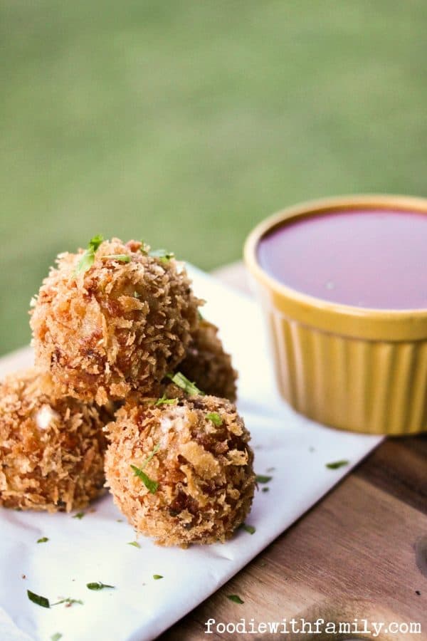 Prosciutto Arancini {crispy cheese-stuffed, fried risotto balls} from foodiewithfamily.com
