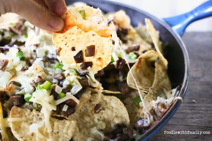 Beef, cheese, onions, peppers, and chips, Cheesesteak Nachos are comfort food deluxe from foodiewithfamily.com