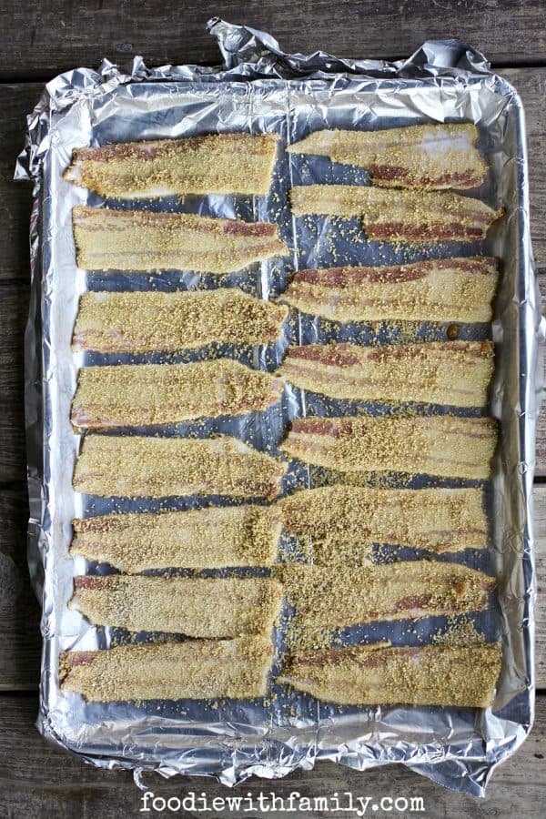 Homemade Maple Candied Bacon being prepared for the oven by foodiewithfamily.com