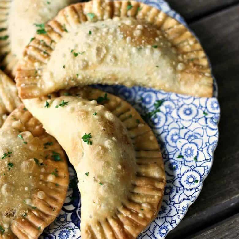 Shepherd's Pie Empanadas {beef, gravy, corn, peas, and mashed potato stuffed in a flaky, golden brown crust} from foodiewithfamily.com