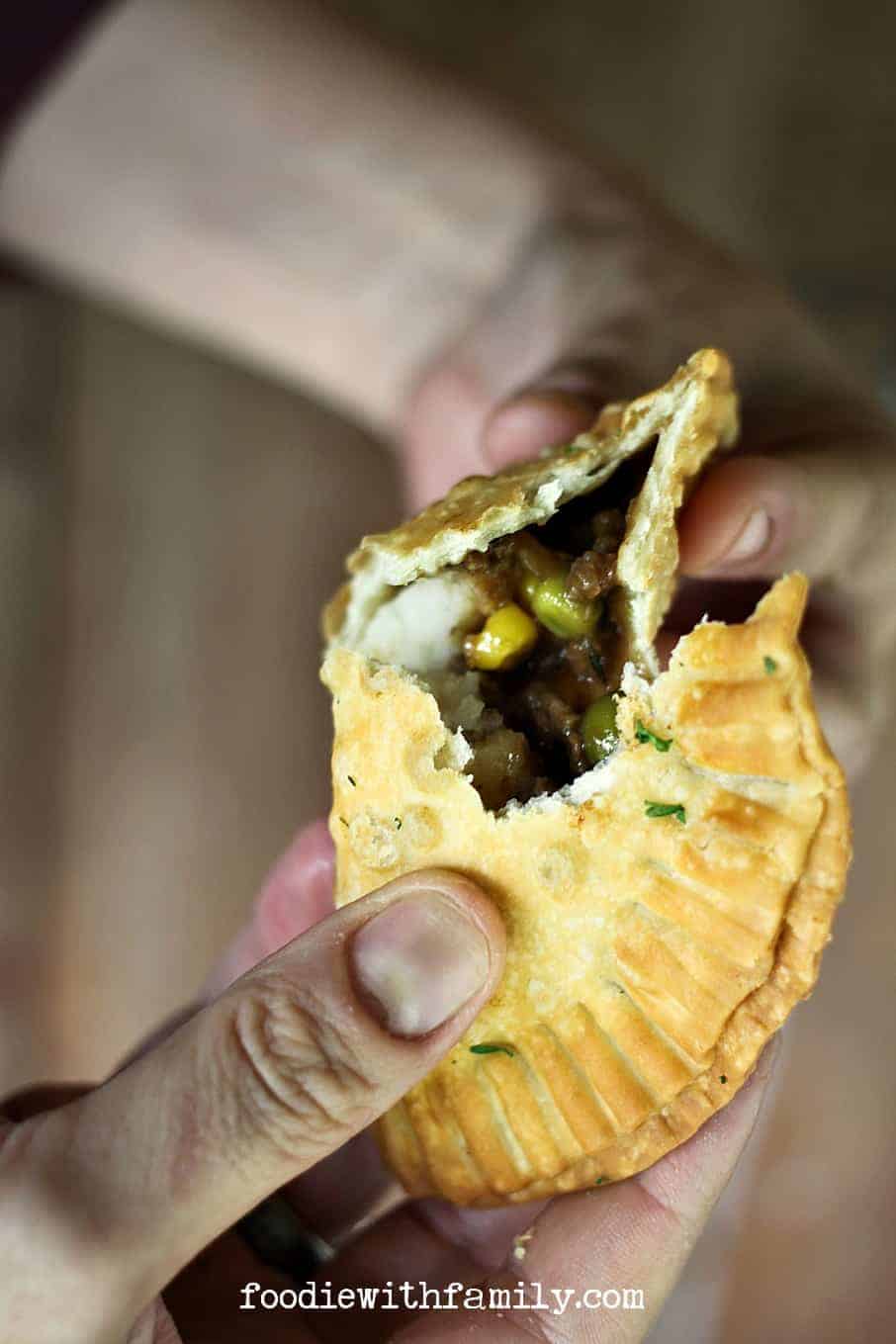 Shepherd's Pie Empanadas {beef, gravy, corn, peas, and mashed potato stuffed in a flaky, golden brown crust} from foodiewithfamily.com