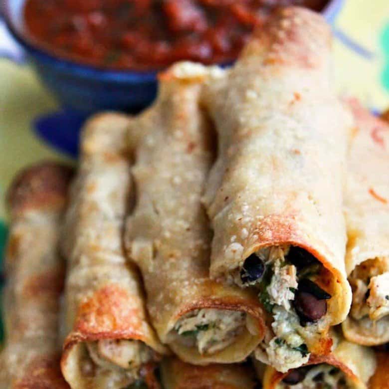 Baked Cheesy Chicken and Bean Taquitos from foodiewithfamily.com