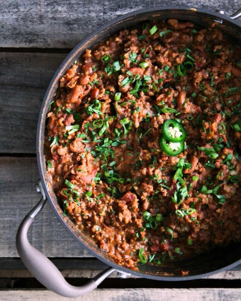 Tex Mex Mash: smashed pinto beans, seasoned browned ground beef, and crispy bacon simmered in a garlicky, chipotle tomato sauce from foodiewithfamily.com