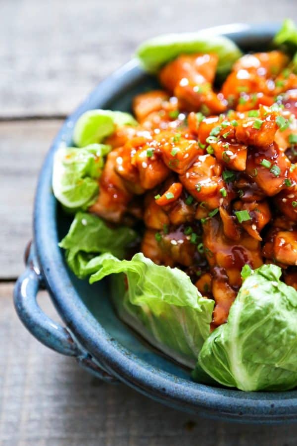 Honey Sriracha Glazed Salmon Bites: Tender salmon tossed in a sticky, sweet, spicy mahogany sauce. Serve in lettuce wraps, or on hot rice.