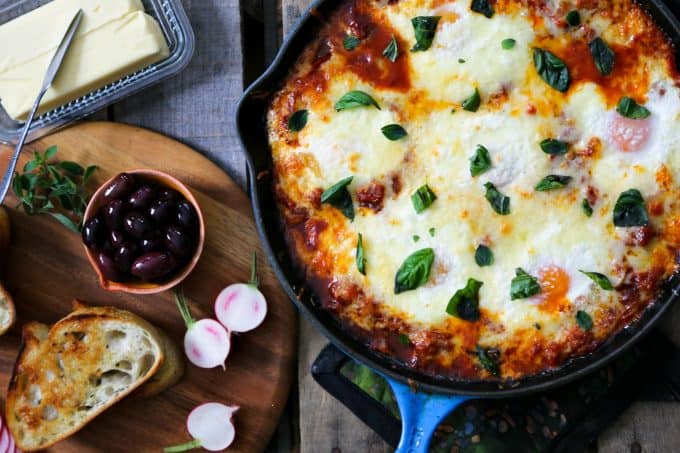 Spicy tomato and red pepper sauce and cheese for Portuguese style Baked Eggs from foodiewithfamily.com