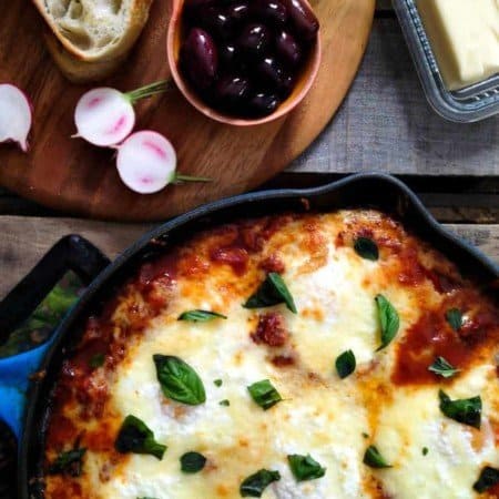 Portuguese Style Baked Eggs. Spicy tomato and red pepper sauce, three cheeses, fresh herbs from foodiewithfamily.com