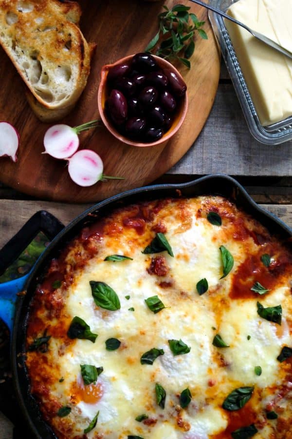 Portuguese Style Baked Eggs. Spicy tomato and red pepper sauce, three cheeses, fresh herbs from foodiewithfamily.com