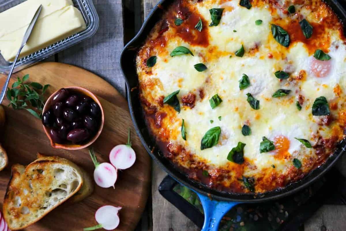 Portuguese Style Baked Eggs {cheesy eggs in spicy red pepper tomato sauce}