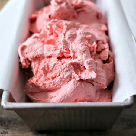 3-ingredient strawberry ice cream, parchment paper lined aluminum bread pan, rustic wooden table