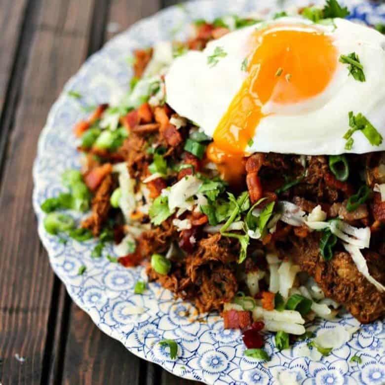 Hash browns with egg cheese beef barbacoa bacon green onions