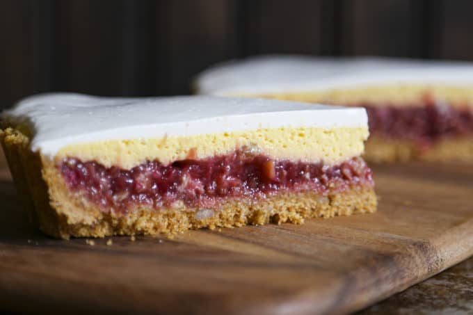 Rhubarb Custard Pie starts with a simple crumb crust that is filled with a tart and sweet rhubarb vanilla filling covered by thin layer of cheesecake and topped with a smooth-as-silk tangy yogurt layer. It's spring and summer perfection, folks.