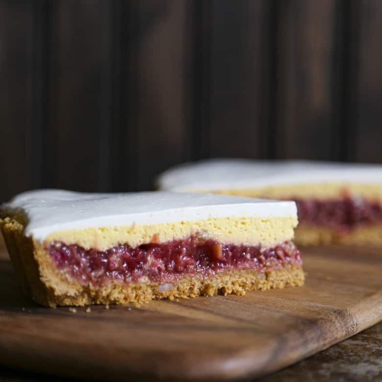 Rhubarb Custard Pie starts with a simple crumb crust that is filled with a tart and sweet rhubarb vanilla filling covered by thin layer of cheesecake and topped with a smooth-as-silk tangy yogurt layer. It's spring and summer perfection, folks.