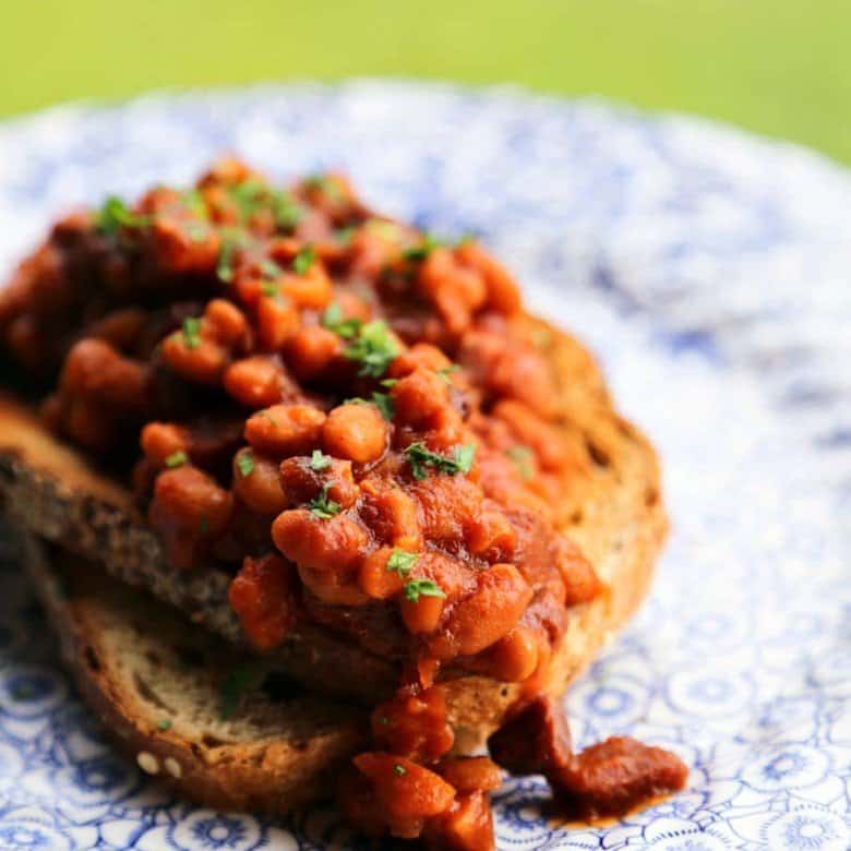 Maple and coffee flavoured Slow-Cooker Breakfast Baked Beans full of Canadian Bacon and breakfast sausage from foodiewithfamily.com