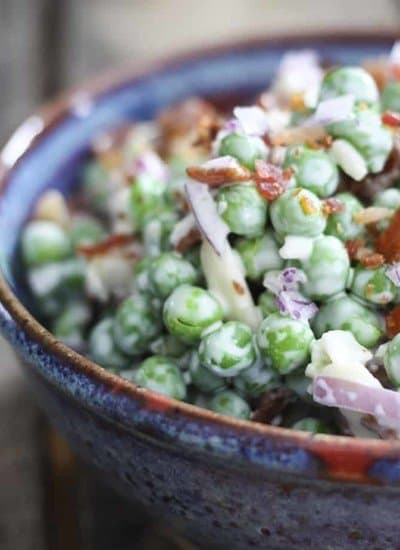 Easy Bacon Pea Salad: It doesn't get much easier or tastier than this cold salad of peas, crispy bacon, crunchy red onions, and creamy dressing. Serve with grilled or roasted chicken, pork, fish, or even ham!
