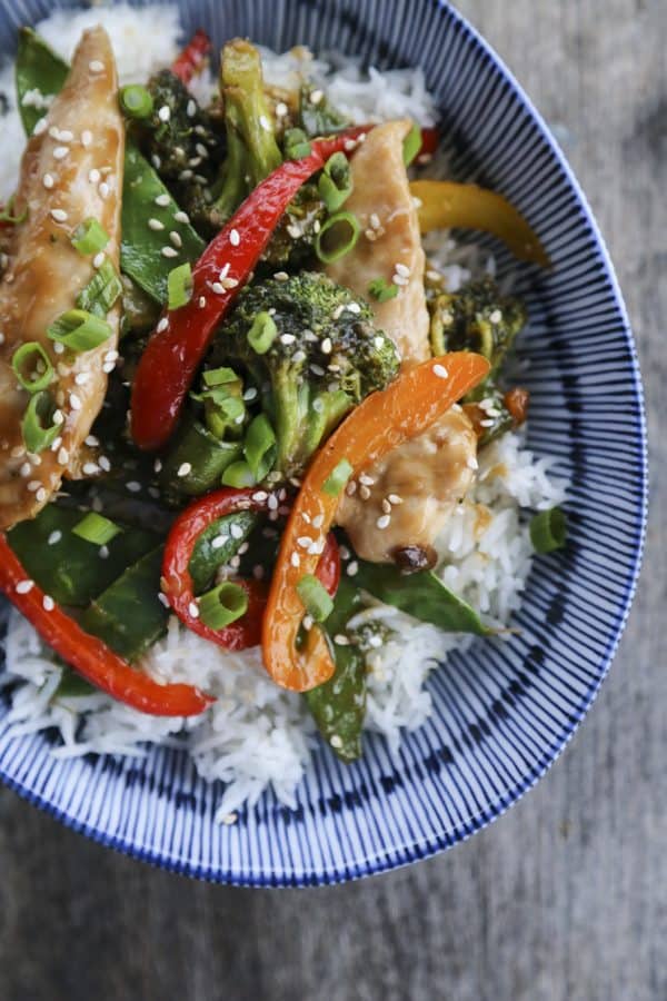 Fabulously fast, filling, and flavourful, this Asian Chicken Stir Fry Sheet Pan Meal will please everyone and feed a crowd economically. 