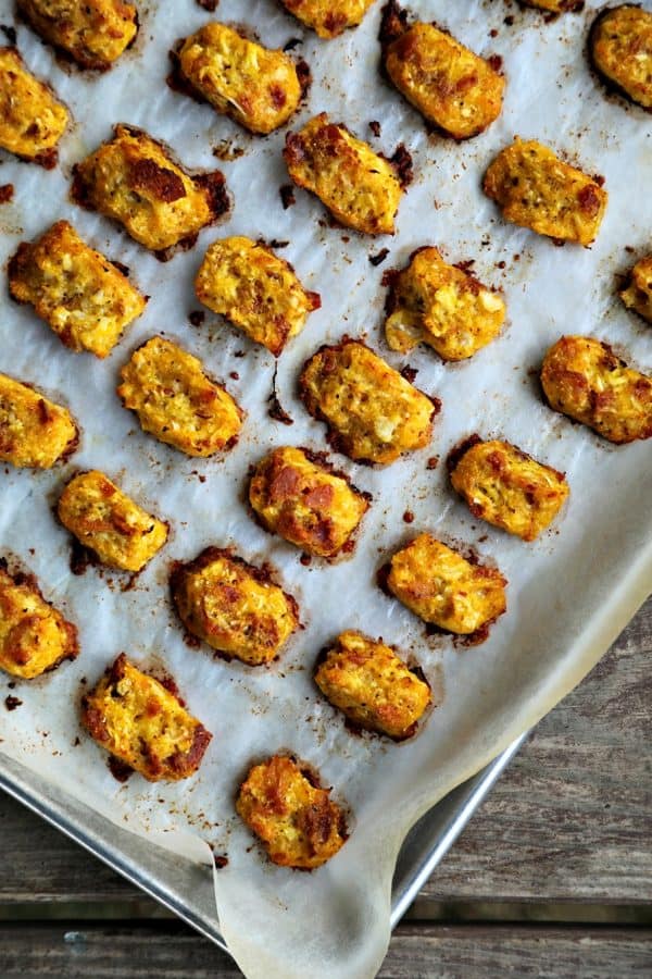 Baked, crispy, Bacon Cheddar Cauliflower Tots {Healthier Tater Tots} are the ultimate in crispy, cheesy perfection. You'd never know they're lower carb than tater tots and honestly, you'd be hard pressed to know they're NOT tater tots. Baked, crispy, Bacon Cheddar Cauliflower Tots {Healthier Tater Tots} are the ultimate in crispy, cheesy perfection. You'd never know they're lower carb than tater tots and honestly, you'd be hard pressed to know they're NOT tater tots. 