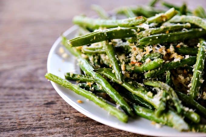 Garlic Parmesan Green Beans: Simple roasted green beans irresistibly coated in crispy garlic, parmesan breadcrumbs.