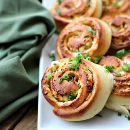 Hot Ham and Cheese Rolls: best bread dough wrapped around smoky ham, piles of Cheddar cheese, and green onions, sliced, and baked to tender perfection.