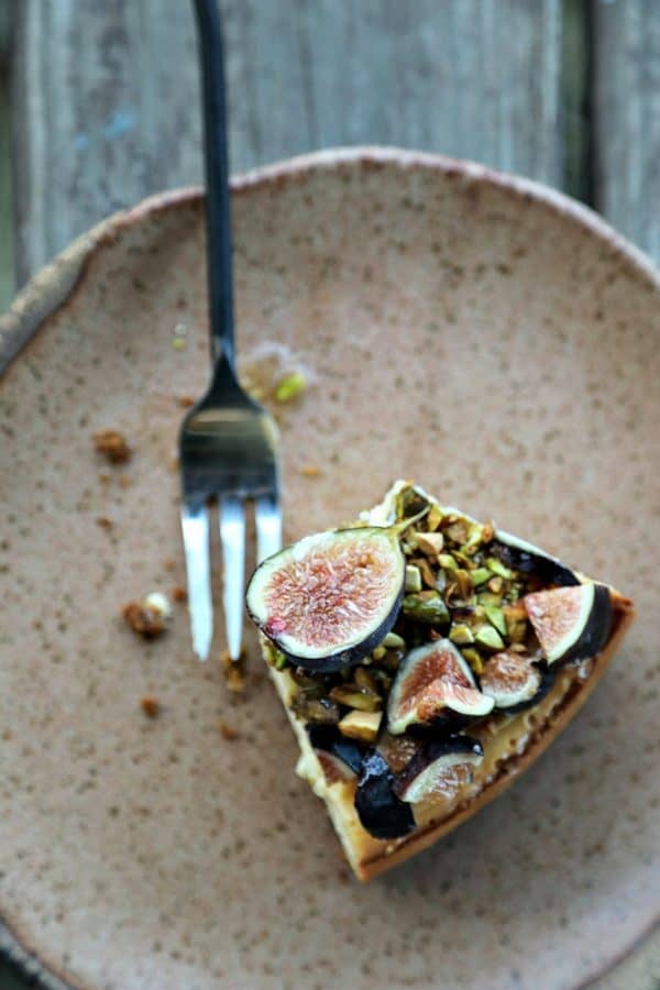 Ultra-creamy, not too sweet, and a feast-for-the-eyes while still being simple to make, this vanilla bean flecked Fig Pistachio Honey Goat Cheese Cheesecake is a show stopper!