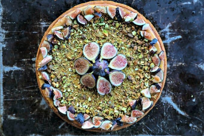 Ultra-creamy, not too sweet, and a feast-for-the-eyes while still being simple to make, this vanilla bean flecked Fig Pistachio Honey Goat Cheese Cheesecake is a show stopper!