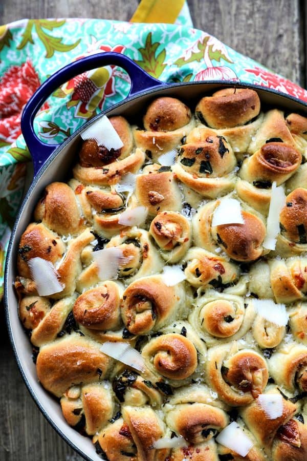 Garlic Basil Parmesan Rolls are my idea of a perfect bread. Perfect bread dough brushed with garlic infused olive oil and rolled around chopped garlic, fresh basil, and flakes of creamy, nutty Parmesan cheese then baked up to a beautiful, golden brown, tender-yet-chewy work of art. 