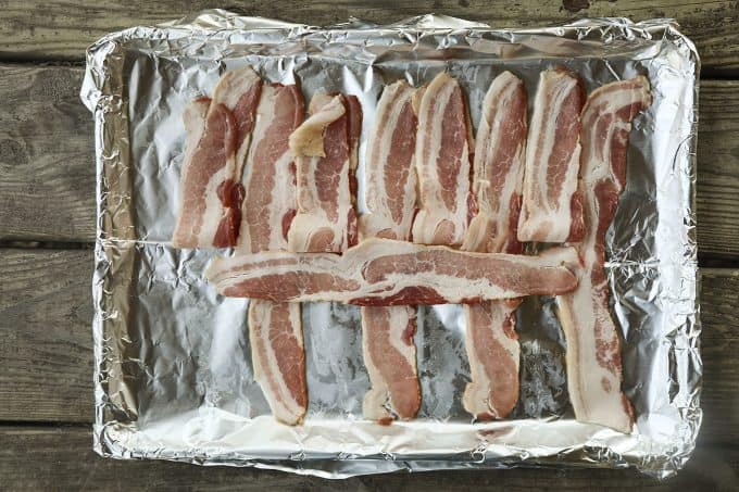 This Low-Carb Bacon Bun Swiss Burger is still seriously indulgent with a basket-weave bacon bun, melted Swiss cheese, a ground chuck burger, a hint of Dijon mustard, leaf lettuce, fresh tomato, and sweet onion. Hang onto that last bit of summer!