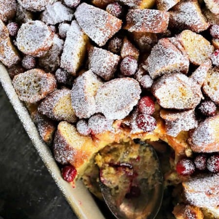 Rich, souffle-like, nutmeg flecked Cranberry Eggnog Doughnut Bread Pudding is the ultimate cold weather dessert.