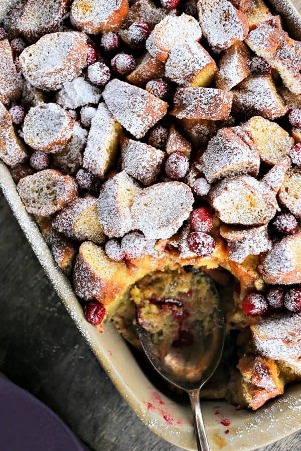Rich, souffle-like, nutmeg flecked Cranberry Eggnog Doughnut Bread Pudding is the ultimate cold weather dessert.