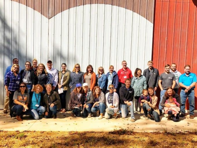 Food bloggers connect with pig farmers in Michigan on a pig farm tour.