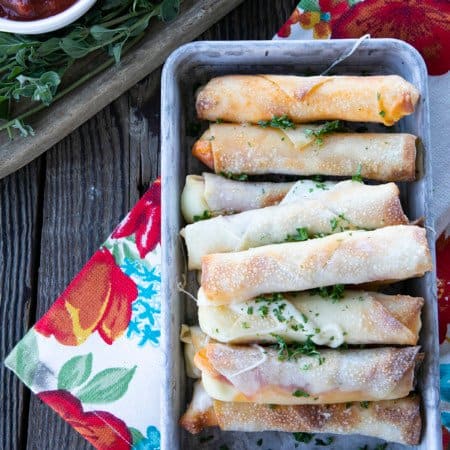 Pizza Logs are crispy, crunchy egg rolls filled with gooey, melted mozzarella cheese and garlicky pepperoni. Whether you whip these up in your air fryer, oven, or in a frying pan, you'll want these not just for game day, but all the time!