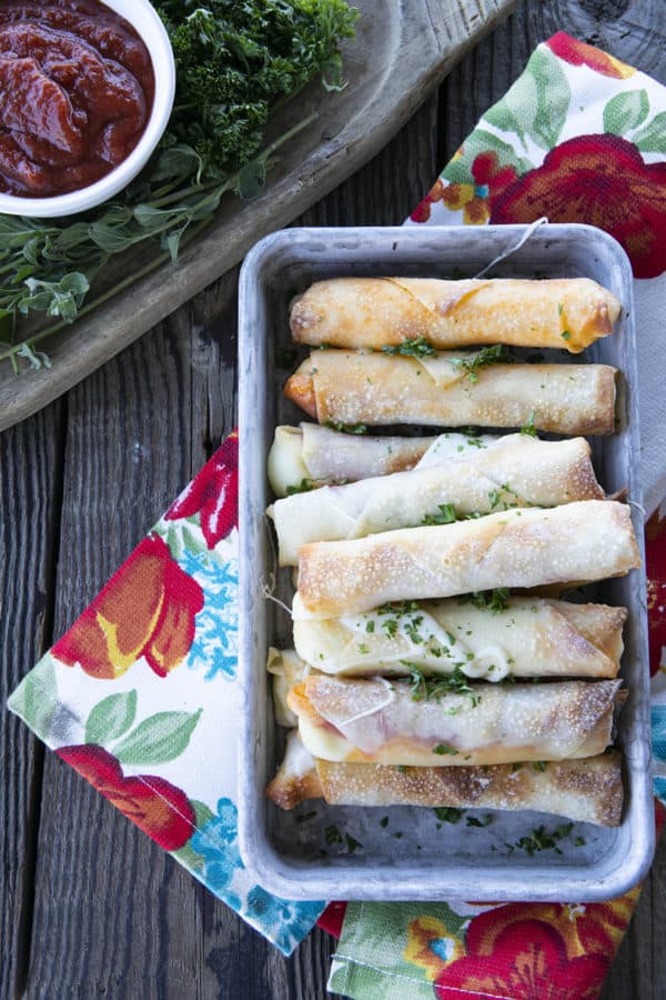 Pizza Logs are crispy, crunchy egg rolls filled with gooey, melted mozzarella cheese and garlicky pepperoni. Whether you whip these up in your air fryer, oven, or in a frying pan, you'll want these not just for game day, but all the time!