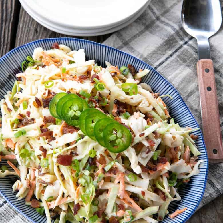 Jalapeno Coleslaw is a deliciously fresh, crunchy, savoury, summery salad to accompany all your grilled main dishes. Creamy, tangy, and easily adjustable to suit your heat-preferences, this super fresh spicy coleslaw is one you'll reach for again and again.